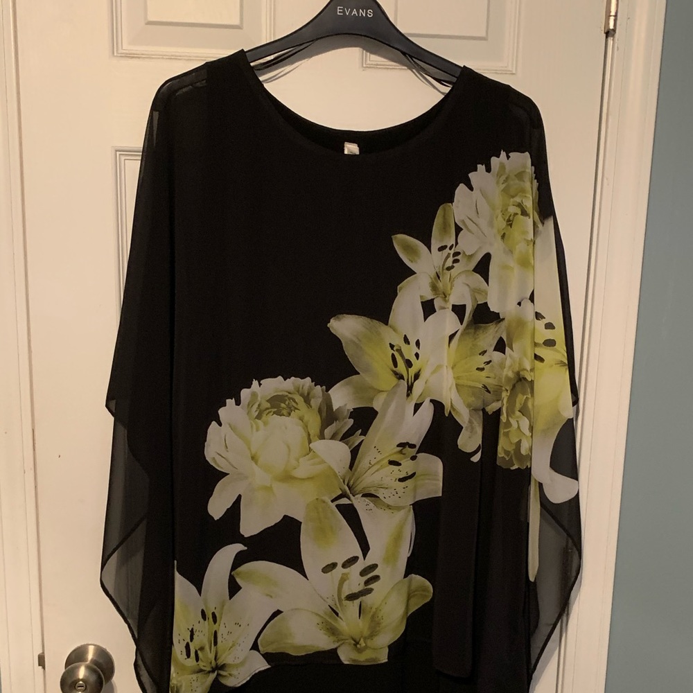 Never been worn. Black with floral accent